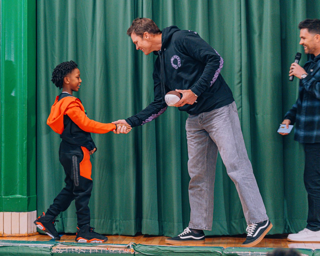 Tom Brady surprises students at Prospect Schools to celebrate his new sports cards store in Brooklyn