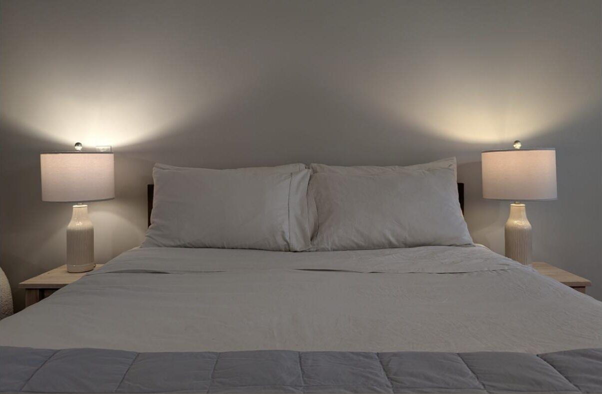 The queen bed in the Greenpoint Guest Suite