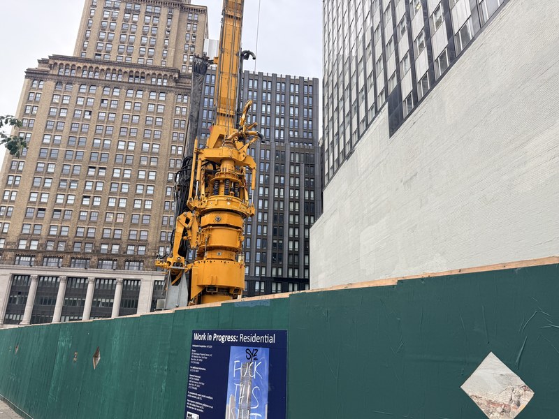 Construction site hoarding at 205 Montague Street in Brooklyn Heights, where the 47-story One Montague Place tower is going up
