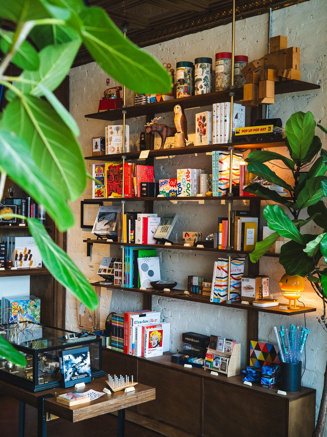 Shelves of puzzles, games and curiosities inside Art of Play on Atlantic Avenue