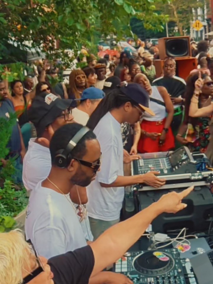 DJs playing to a crowd at a Saint James Joy block party in Clinton Hill