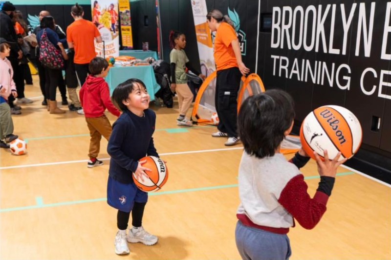 Kids shooting basketballs at the Brooklyn Basketball Training Center in Downtown Brooklyn