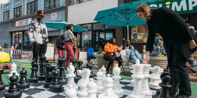 People at a Downtown Brooklyn open-street event on Willoughby Street