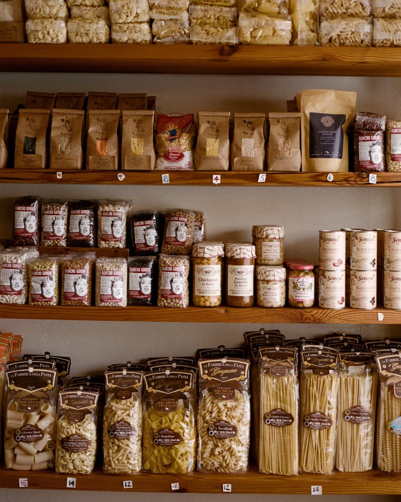 Pasta and heirloom beans on the shelves at First Bloom, Alison Roman’s grocery store