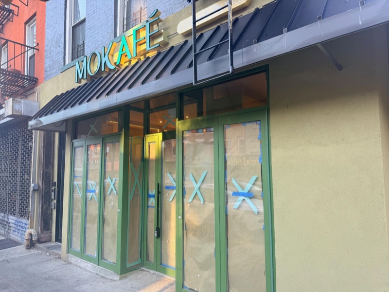Mokafé’s new coffee shop at the corner of Pacific and Smith streets, sign up and windows papered before opening