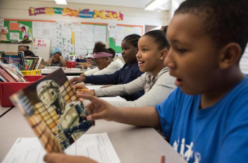 Students reading at their desks in a P.S. 307 classroom