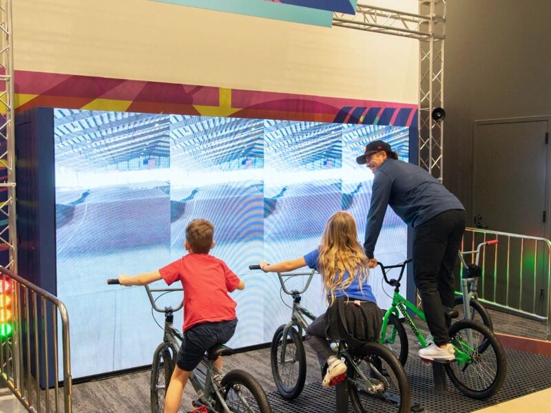 Kids on BMX bikes in the Riders Ready exhibit at Brooklyn Children’s Museum