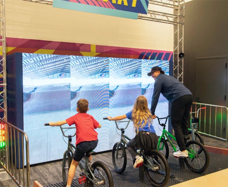 Kids on BMX bikes in the Riders Ready exhibit at Brooklyn Children’s Museum