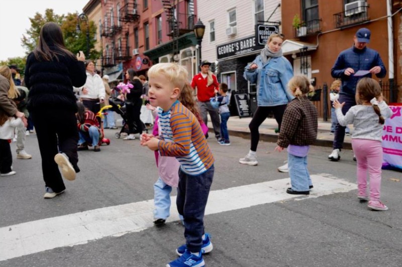 Children dancing on car-free Smith Street at the Brooklyn Bridge Parents Kids Zone